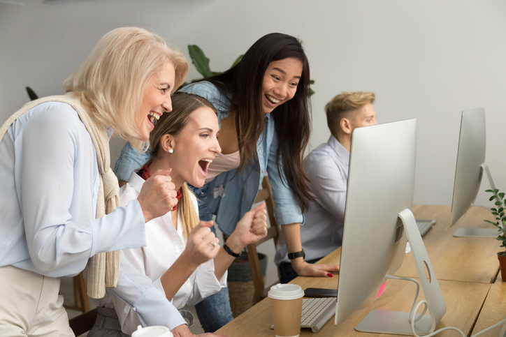 Women excited over news on computer